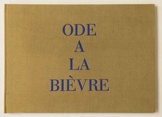 an old book with blue writing on the front and back cover that says, ode a la bievre