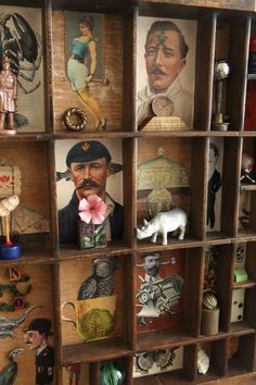 an old wooden shelf with pictures and figurines on it