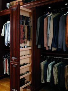 the closet is full of clothes and ties