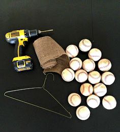 a bunch of baseballs sitting on top of a table next to a cordless drill