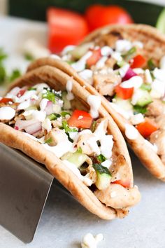 two pita breads filled with vegetables and cheese