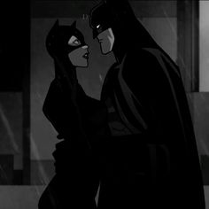 batman and catwoman kissing in the rain