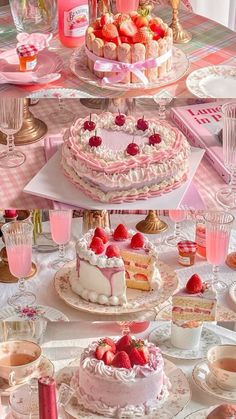 a table topped with cakes and desserts covered in frosting