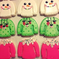 decorated cookies in the shape of sweaters and snowmen