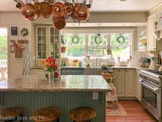 a kitchen filled with lots of counter top space next to an oven and stove top oven