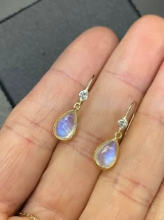 "Natural Blue Moonstone and Diamond 14K Yellow Gold Drop Earrings The diamonds are .06 carats each, VS with  F color. The moonstones are each approximately 2 carats, with a double sided cabochon cut. 1.5\" long from top to bottom  Made in solid 14K yellow gold. Custom orders welcome!" 14k Yellow Gold Drop Earrings, Moonstone Earrings Gold, Yellow Gold Drop Earrings, Cabochon Earrings, Gemstone Drop Earrings, Gem Earrings, Blue Moonstone, Piercings Jewelry, Earring Gold