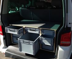 the back end of a van with drawers in it