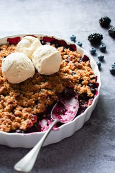 a blueberry crisp with ice cream on top