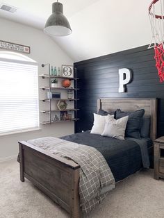 a bed room with a neatly made bed and shelves on the wall next to it