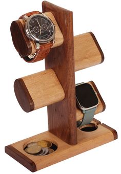 a wooden watch stand with two watches on it's sides and an iphone in the middle