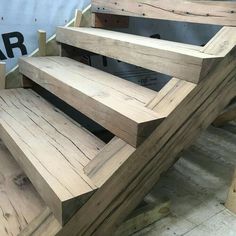 some wooden stairs are being built in a shop