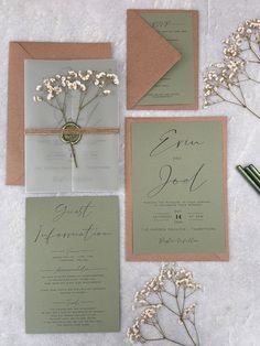 the wedding stationery is laid out and ready for guests