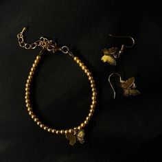 This elegant jewelry set in a golden color includes a bracelet and earrings featuring delicate butterfly charms. Details:  * Bracelet length: 16.5 cm (6.5 inches) with an additional 5 cm (2 inches) extender for adjustable sizing.  * Butterfly charm dimensions: 11 mm (0.43 inches) in length, 12.5 mm (0.49 inches) in width.  * Earrings length: 2.7 cm (1.06 inches). Check out more of my work here: https://vdaliprykrasy.etsy.com https://www.instagram.com/vdaliprykrasy_?igsh=ZHNvcTRoMmJqMjVk Earring Butterfly, Bracelet Butterfly, Butterfly Earrings Gold, Delicate Butterfly, Butterfly Butterfly, Butterfly Bracelet, Gold Butterfly, Butterfly Charm, Butterfly Earrings