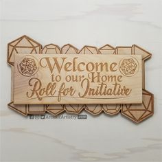 a wooden sign that says welcome to our home roll for initialise on the wall