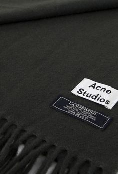 black scarf with acne studios label on it