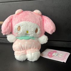 a hello kitty stuffed animal sitting on top of a table