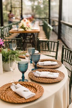 the table is set with place settings for dinner