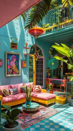 a living room filled with lots of colorful furniture and plants in front of a blue wall