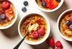 three bowls filled with oatmeal topped with fruit