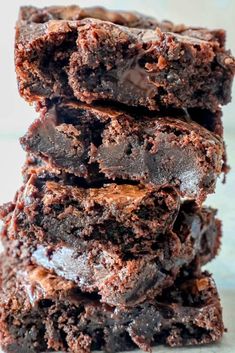 chocolate brownies stacked on top of each other