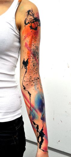 a woman with a colorful arm tattoo on her left arm and the other arm is covered in black ink