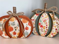 three decorative pumpkins sitting on top of a table