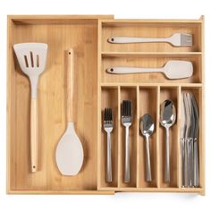 a drawer with utensils and spoons in it