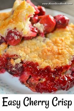 a close up of a slice of cherry crumbler pie on a plate