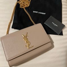 Authentic Ysl Kate Small In The Color Dark Beige. This Beautiful Date Night/Casual Occasion Purse Is In Brand New Condition!!! No Scratches Or Damages. Wore 3-4 Times Since Bought Within In A Few Months Ago. It Has A Gold Chain And Comes With A Dust Bag. Please Feel Free To Message Me With Any Inquiries Regarding The Bag :) Ysl Kate Bag Beige, Ysl Kate Small Silver, Ysl Kate Suede Bag, Yves Saint Laurent Bag Beige, Ysl Kate Bag, Ysl Kate, Kate Bags, Beige Bag, Yves Saint Laurent Bags