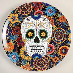 a decorative plate with a colorful sugar skull on it