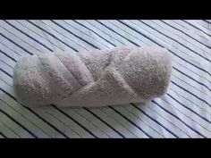 a white towel folded on top of a bed