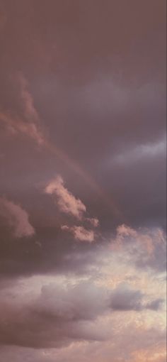 a plane is flying in the sky at sunset