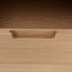 a wooden drawer with a handle on it