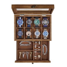 an open wooden watch box filled with lots of different watches and bracelets on display