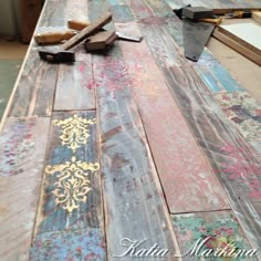 an old wooden table is being worked on