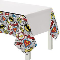 a white table topped with a batman themed table cloth