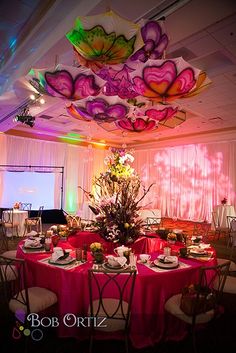 an image of a banquet room setting with flowers on the ceiling