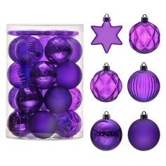 purple christmas ornaments are in a glass container