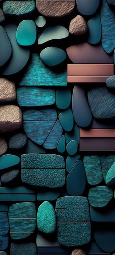 a wall made up of rocks and stones on top of each other with different colors