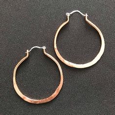 These stunning copper earrings are done in a simple elegant hoop design. The ones in the Pictures measure 2 1/4 inches from the top of the ear wire to the bottom of the earring. And they are 1 3/4 inches wide. (SIZE LARGE)They are also available in a smaller Size of 1 3/4 inches long and 1  1/4 inches Wide (SIZE MEDIUM) or 1.25 long and 1 inch wide( Size SMALL)Please choose Size LARGE,MEDIUM, or SMALL when Ordering. Also Choose Copper or Sterling Earwires.( the earwires in the pictures are sterl Everyday Copper Drop Earrings, Hand Forged Copper Dangle Hoop Earrings, Hand Forged Copper Hoop Earrings With Dangle, Nickel-free Small Hoop Copper Jewelry, Everyday Hammered Rose Gold Earrings, Elegant Everyday Copper Earrings, Everyday Rose Gold Hammered Earrings, Bronze Hammered Hoop Earrings, Bronze Metal Hoop Earrings