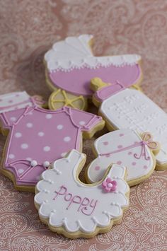 some decorated cookies are sitting on a table