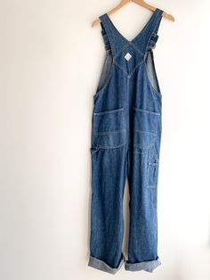 Dark wash, soft denim Penney’s Square Bak overalls. Union made sanforized circa 50/60’s in great condition. Really the perfect pair of overalls. Adjustable straps with original heavy duty metal hardware and buttons. Fabric: DenimLabel: Big Mac Fit: O/S Measurements: Waist 36" Hips 42" Bib width 11" Rise (from top of bib) 25" Inseam 30" Length (at side) 44" Leg opening 10" Condition: Excellent Retro Overall Jeans With Pockets, Vintage Denim Overall Jumpsuit, Utility Style Washed Denim Overalls, Vintage Denim Blue Jumpsuit With Pockets, Vintage Medium Wash Washed Overalls, Vintage Denim Overalls In Medium Wash, Vintage Medium Wash Denim Jumpsuit For Work, Vintage Medium Wash Denim Overalls, Vintage Dark Wash Denim Jumpsuit With Straight Leg