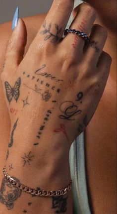 a woman's arm with tattoos on it