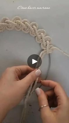 someone is crocheting something with yarn