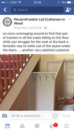 a man standing in front of a white refrigerator freezer next to a stair case