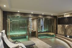 a spa room with a large glass shower