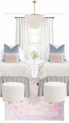 a bedroom with two beds and pillows on top of the bed in front of a chandelier