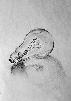 a pencil drawing of a light bulb sitting on top of a table