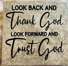 a sign that says, look back and thank god to look forward and trust god