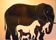 an elephant and her baby are depicted in this stencil on the side of a wall